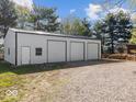 Spacious three-car garage with ample parking and storage space at 3868 E Worthsville Rd, Whiteland, IN 46184