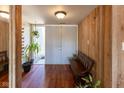 Inviting entryway with hardwood floors, bench seating, and accent plants at 5077 Vantage Point Rd # 1 Wm-5-1, Avon, IN 46123