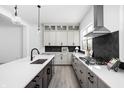 Spacious kitchen with black and white cabinets, stainless appliances, and a large island perfect for entertaining at 525 Fynn Pl, Indianapolis, IN 46202