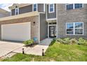 Lovely two-story house with a two-car garage and manicured landscaping at 5256 Bramwell Ln, Whitestown, IN 46075