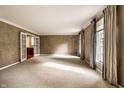 Large living room with textured walls and French doors offers lots of natural light at 5356 S U.S. Highway 421, Zionsville, IN 46077