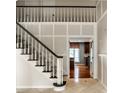 Elegant staircase with black handrail leads to the second floor and offers an open view at 5356 S U.S. Highway 421, Zionsville, IN 46077