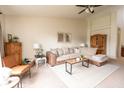 Inviting living room featuring a comfortable sectional sofa, neutral carpet, and bright natural light at 5957 Haywood Ct, Greenwood, IN 46142