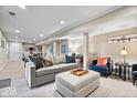 Finished basement features neutral colors, comfortable seating and good lighting, creating a cozy and versatile living space at 5958 Cape Cod Ct, Indianapolis, IN 46250