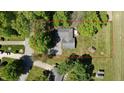 Aerial view showcasing the property's large lot, mature trees, and overall setting at 5979 E Oak Hl Dr, Plainfield, IN 46168