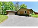 This brick home offers an attached garage, a long driveway, and easy access at 5979 E Oak Hl Dr, Plainfield, IN 46168