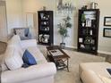 Inviting living room with bookshelves, a comfortable sofa, and elegant decor at 6403 Yuma Ct, Whitestown, IN 46075