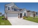 A beautiful two-story home featuring a spacious driveway and lovely front yard at 7234 Darley Ln, Indianapolis, IN 46259