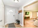 Bright entryway with wood flooring and stylish decor at 7771 Delbrook Dr, Indianapolis, IN 46260