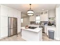 Modern kitchen boasts stainless steel appliances and a stylish center island at 1043 N Beville Ave, Indianapolis, IN 46201