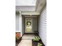 A welcoming entryway with a glass-paneled door and a small bench at 10551 Huckleberry Ct, Noblesville, IN 46060