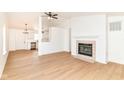 Bright living room features hardwood floors, fireplace with white shiplap, and an open concept design at 11816 Wapiti Way, Noblesville, IN 46060