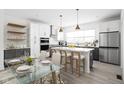 Elegant kitchen with a center island, stainless steel appliances, and a dining area at 1322 Colere Pl, Indianapolis, IN 46203