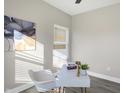 Home office features a modern desk, wood-style flooring, and natural light at 1429 Deloss St, Indianapolis, IN 46201