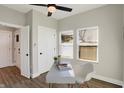 Bright office features a modern desk, ceiling fan, and wood-style flooring at 1429 Deloss St, Indianapolis, IN 46201