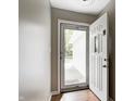 Inviting entryway features new vinyl flooring and lots of natural light coming through the storm door at 1604 Stacy Lynn Dr, Indianapolis, IN 46231
