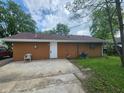 Back of house with a concrete patio and well maintained central air conditioning unit at 1614 Dayton Ave, Indianapolis, IN 46203