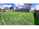 Expansive fenced backyard with lush green grass offers plenty of room for recreation at 170 Briar Hill Dr, Whiteland, IN 46184