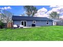 Spacious backyard with a well-maintained lawn and a patio area for outdoor enjoyment at 170 Briar Hill Dr, Whiteland, IN 46184