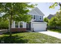 Attractive two-story home with a two-car garage and a lush green front yard at 19570 Forsythe Dr, Noblesville, IN 46060