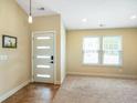 Bright entryway featuring a modern door, neutral paint, and tile flooring at 204 Oakview Dr, Mooresville, IN 46158