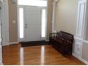 Inviting foyer featuring a bright entryway, hardwood floors, and a classic bench at 2219 Stone Manor Ct, Avon, IN 46123