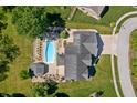 Aerial view of backyard featuring a sparkling swimming pool and a beautiful gazebo at 28 Hudson Bay Ln, Greenwood, IN 46142