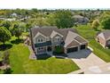 Beautiful home boasts professional landscaping, a two-car garage, and a manicured lawn at 28 Hudson Bay Ln, Greenwood, IN 46142