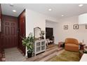 Inviting living space with a console, decor, an accent chair, and wood-look flooring at 3110 W New York St, Indianapolis, IN 46222