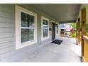 Inviting covered porch with sturdy railings and stylish front door at 3216 N Kenwood Ave, Indianapolis, IN 46208