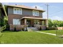 Charming two-story brick home featuring a classic design and well-maintained lawn at 3370 N New Jersey St, Indianapolis, IN 46205