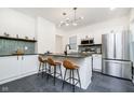 Modern kitchen features stainless steel appliances, sleek countertops, and stylish island seating at 3370 N New Jersey St, Indianapolis, IN 46205