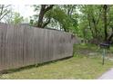 A tall wooden fence runs the length of the lot, providing privacy at 338 E Park St, Westfield, IN 46074