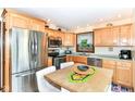 Eat-in kitchen features stainless steel appliances and light wood cabinetry at 436 Maria Dr, Greenwood, IN 46143