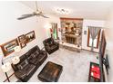 Spacious living room features a brick fireplace, plush seating and neutral carpet at 436 Maria Dr, Greenwood, IN 46143