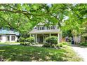 Charming home featuring a covered front porch, well-maintained landscaping, and inviting outdoor space at 4527 Central Ave, Indianapolis, IN 46205
