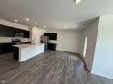 Spacious eat-in kitchen featuring stainless steel appliances and dark cabinets for a sleek style at 5863 Handbell Ln, Greenwood, IN 46143