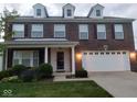 Charming brick two-story home with a two-car garage and well-manicured landscaping at 6836 Eagle Crossing Blvd, Brownsburg, IN 46112