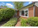 Welcoming front entrance with brick walkway and lush landscaping at 7060 N Park Ave, Indianapolis, IN 46220