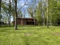 A beautiful two-story home sits amongst a grassy lawn and mature trees at 830 Millerwood Dr, Lebanon, IN 46052