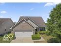 Charming brick home with a well-manicured lawn, showcasing its inviting curb appeal at 8644 S Tibbs Ave, Indianapolis, IN 46217