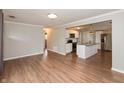 Spacious living room open to kitchen with stainless appliances and island at 916 S Outer Dr, Lebanon, IN 46052