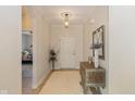 Inviting foyer featuring neutral walls, elegant lighting, and stylish decor at 9789 Rue Renee Ln, McCordsville, IN 46055
