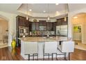 Gourmet kitchen with granite countertops, stainless steel appliances, and breakfast bar at 9789 Rue Renee Ln, McCordsville, IN 46055