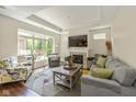 Bright living room with large windows, fireplace, and hardwood floors at 9789 Rue Renee Ln, McCordsville, IN 46055