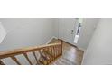 Clean entryway with staircase features tile floor by door, leading to carpeted stairs at 1111 Cavendish Dr, Carmel, IN 46032