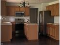 Well-equipped kitchen with stainless steel appliances and a functional center island at 11727 Wedgeport Ln, Fishers, IN 46037