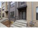 View of the townhome entrance featuring brick facade and small porch area at 1216 N Alabama St, Indianapolis, IN 46202