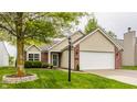 Charming single-Gathering home with a well-manicured lawn and a two-car garage at 12328 Slate Dr, Fishers, IN 46037