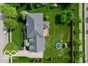 Aerial view of a home highlighting the spacious backyard, deck, and mature trees at 13868 Broad Mdw, Carmel, IN 46032